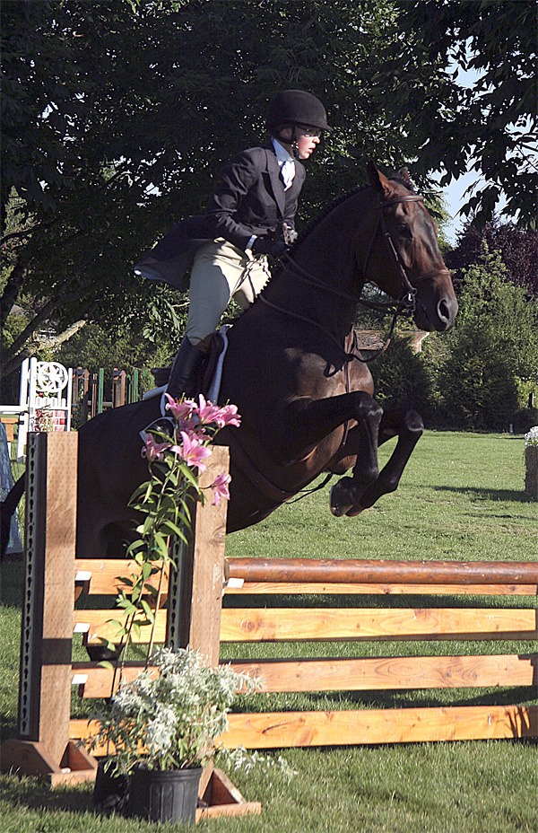 Margot Nelson leaps Bayardo over an obstacle in the Bonnie Coffin Hunter Classic