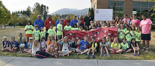 Children and adults from the YMCA and Snoqualmie Tribe gather for a group photo in recognition of the tribe’s major gift