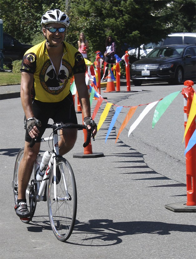 A rider cruises to the finish line of the Tour de Peaks ride in North Bend.