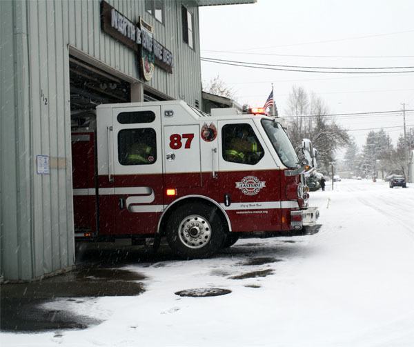 An engine rolls out of the North Bend Fire Station during a November 22 call. The station