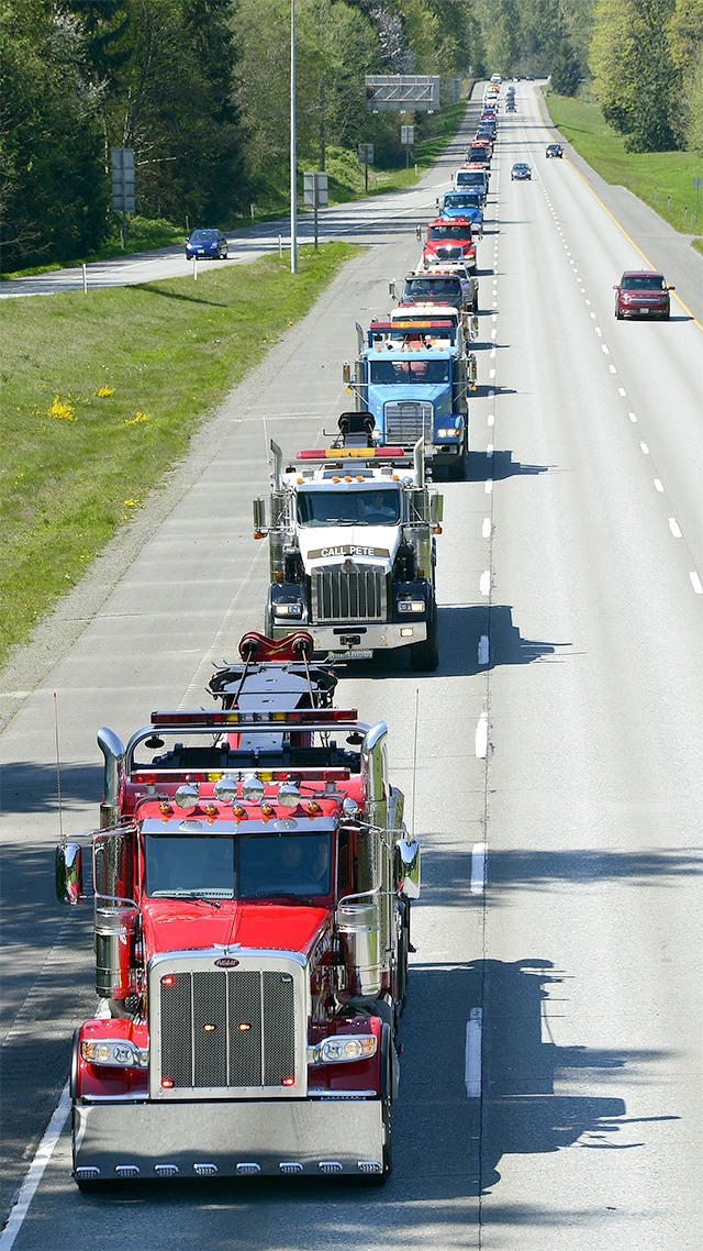 A line of 74 tow trucks make up the memorial procession for the late Dennis Todd.