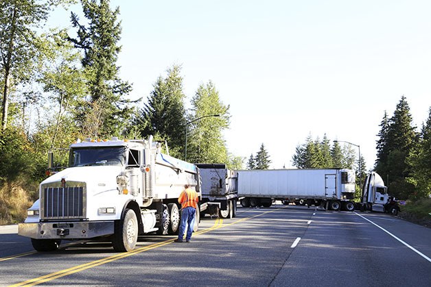 A crash involving a dump truck and a semi shut down Snoqualmie Parkway Tuesday morning.