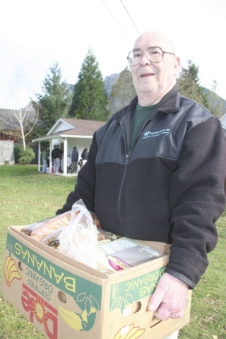 Jim Hood of North Bend holds a box of staples to share with his wife