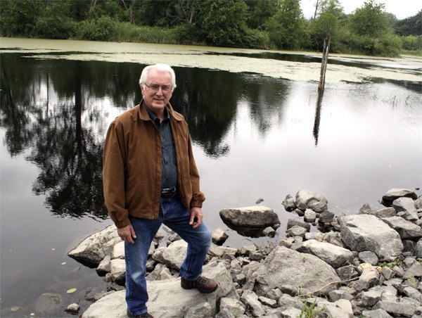 The still waters of Lake Borst hold promise in former timberland manager Dick Ryon's vision. He'd like to see the former Weyerhaeuser mill pond be part of a parks and flood protection system in the city of Snoqualmie. The future of the mill site is being defined in this summer's debate on annexation conditions.