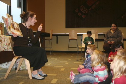 Carnation Children's Librarian Jenn Carter reads a book to a number of children during their afternoon story time. King County Libraries seek a voter approved lid lift in the Feb. 9 election. Passage means continued support for materials and programs. Failure means 'things will just get tighter
