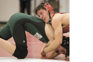 Mount Si grappler Andrew Sypher maneuvers his Skyline opponent during a match-up Thursday
