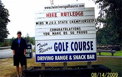 A sign at the Rutledge family-owned Twin Rivers Golf Course in Fall City hails champ golfer Mike Rutledge. The recent Mount Si High School graduate won a state summer championship in his division.