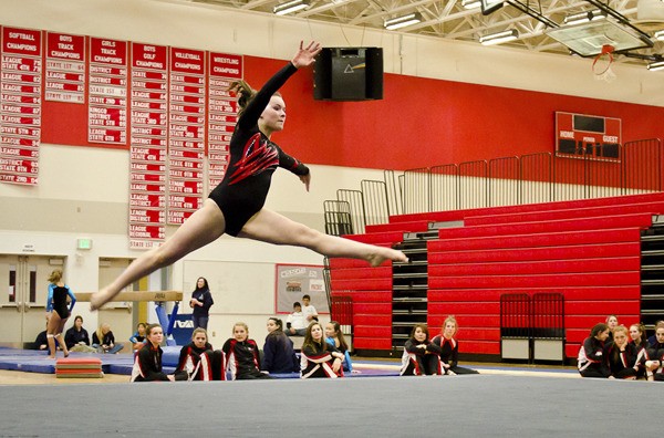 Mount Si’s Jenn Rogers leaps in her floor routine during a team meet Thursday