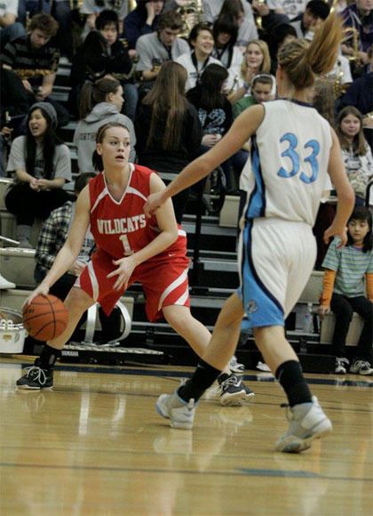 Tracy Nelson works the ball as Interlake tries to block. Mount Si survived tough challenges to post a 64-44 win Saturday.