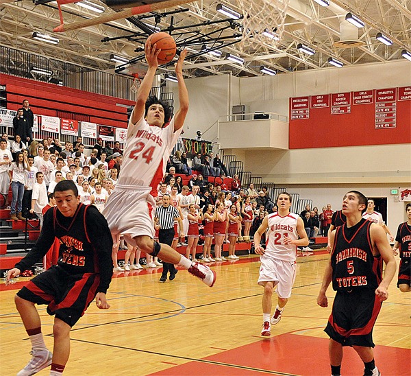 Mount Si junior Mason Bragg jumps for a shot against the Totems during a second-half charge in the Friday