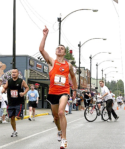 Raising a “1” sign in triumph