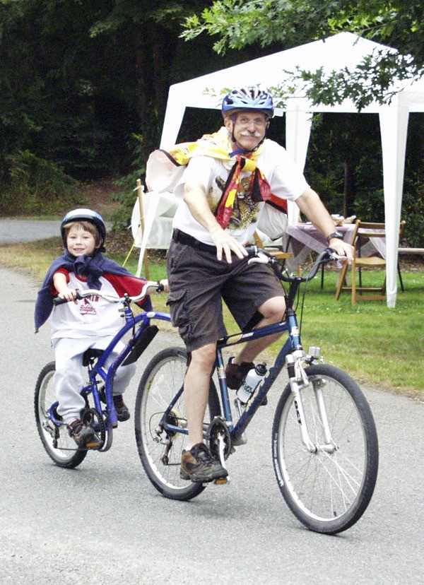 A duo rides in the Tour de Peaks bike ride