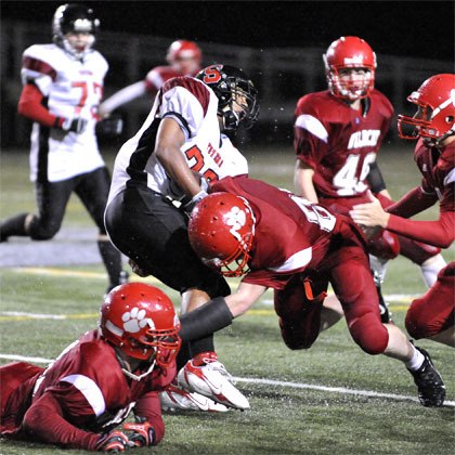 Mount Si player Code Blair tackles a Sammamish carrier