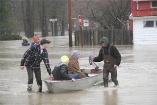 Ferrying supplies to their waterlogged home