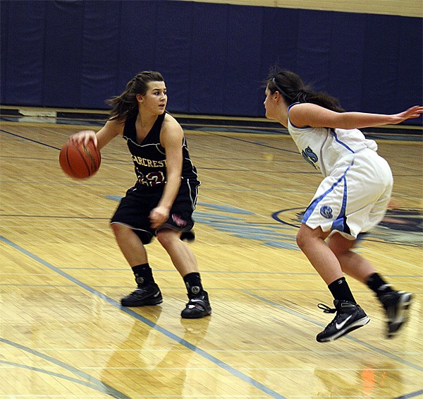 Cedarcrest High's Susan Kenney pushes for the basket against an Interlake defender during play Thursday