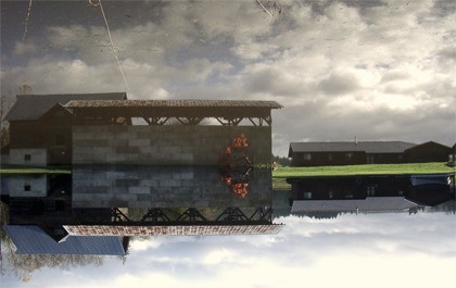 First place winner Megan Caros's image of buildings floating in their own reflections in floodwater wowed staff judges.