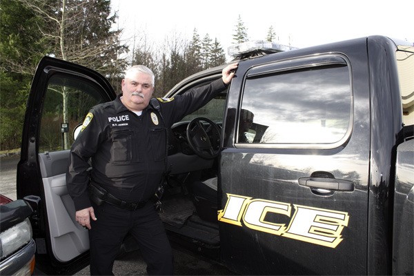 Snoqualmie Police Officer Dave Johnson gets ready to go out on patrol on his last week of work for the department. He retired on January 29