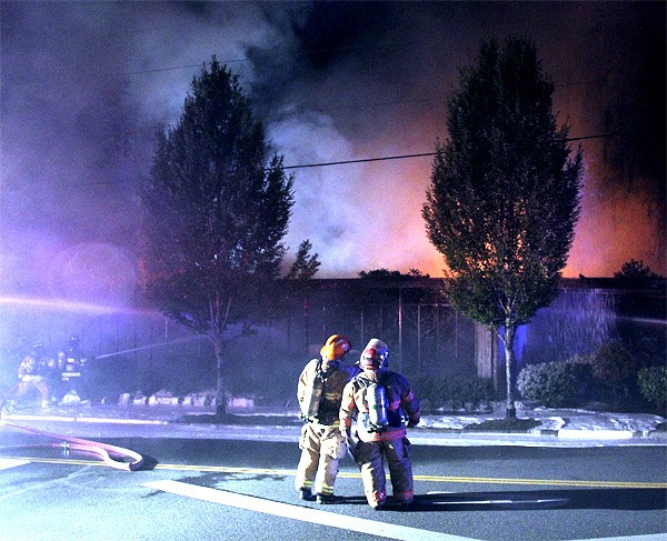 Firefighters attack a raging blaze at Snoqualmie Medical Clinic late Friday