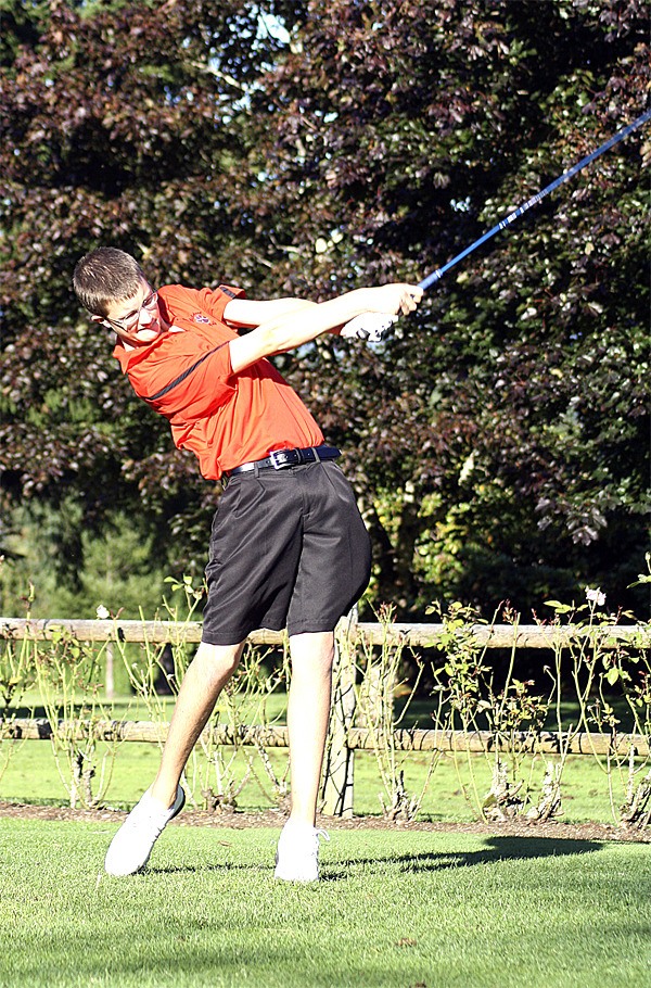 Mount Si's Sean Ballsmith clobbers the ball on hole 5 of the Mount Si Golf Course during play Thursday. Ballsmith was one of three Wildcat golfers to hit 37s Thursday.
