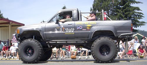 L.J. Toy Auto Repair’s big four wheeler makes an appearance at last summer’s Carnation grand parade. Owner John Petree is masterminding the Fourth of July auto show this year.