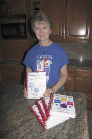 Mary Anne Rohrbach gathered memories along with recipes to create the new Relay for Life cookbook. The Fall City resident now has a stack on hand for gifts.