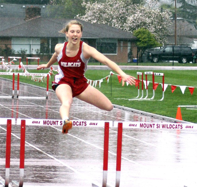 Rain runner Sydney Leonard wraps up the 300 meter hurdles event. She was second