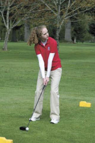 Maggie Robinson tees off during play Thursday