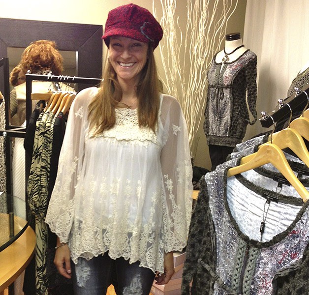 Model Kylan Ooyman tries on one of her show outfits at a fitting appointment for the upcoming Fall Fashion Show