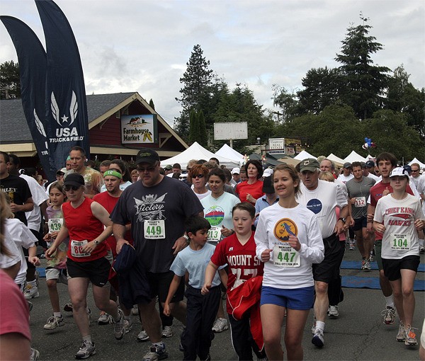 Runners race through downtown Fall City in the Fall City Days Fun Run. The foot race for adults and children returns Saturday.
