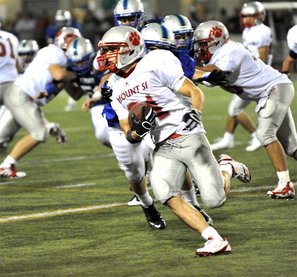 Mount Si senior running back Shelby Williams carries the ball during play Friday