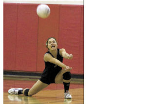 Mount Si’s Bethany Frieler digs the ball during the Wildcats’ league championship volleyball game against Mercer Island last Friday