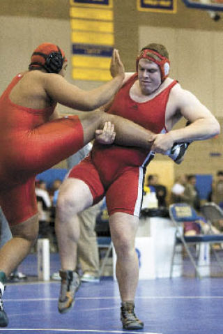 Mount Si’s Ryan Ransavage folds up an opponent at the state qualifier last weekend.