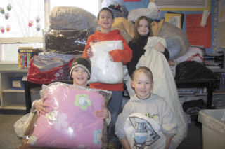 Helping collect more than 80 warm blankets for those who need them