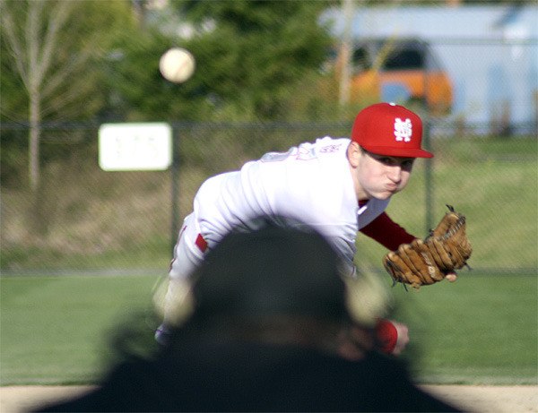Mount Si junior Trevor Taylor fires a pitch during play Friday