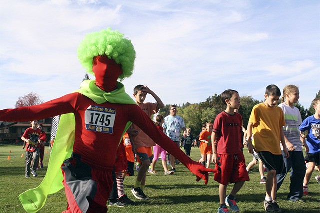 The most eye catching costume of the SES Orange Ruler fun run Oct. 15 belonged to the mysterious student in red with a neon green afro wig.