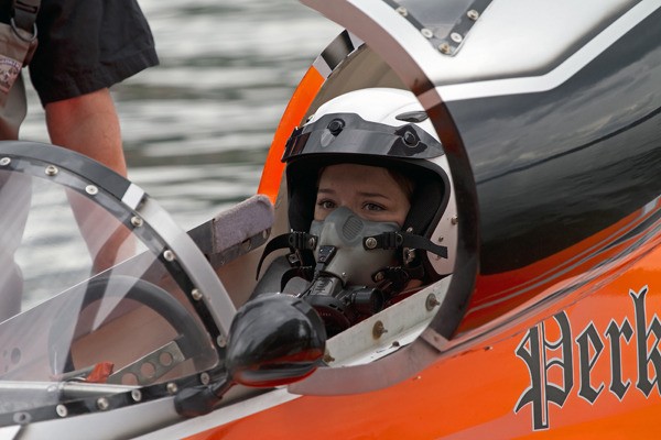 Katie Forsell of North Bend tries out local racer Brian Perkins’ racing hydroplane on Lake Sammamish earlier this summer. The 21-year-old college student is a SeaFair volunteer and Miss Red Dot pit crew helper