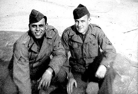Burt Mann (left) and Chet Schilden pose for a photo in England before D-Day. Schilden was killed in action.