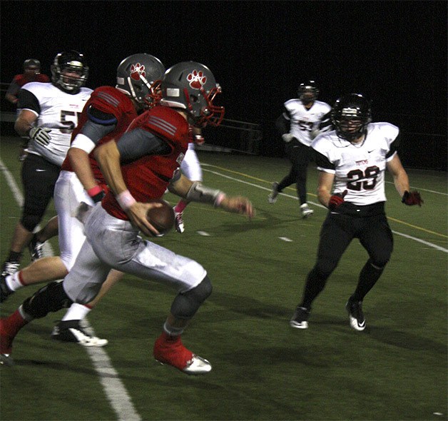 Nick Mitchell rushes in the first quarter of the Sammamish game. He was good for 42 yards on foot