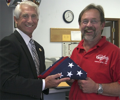 Congressman Dave Reichert presents a flag