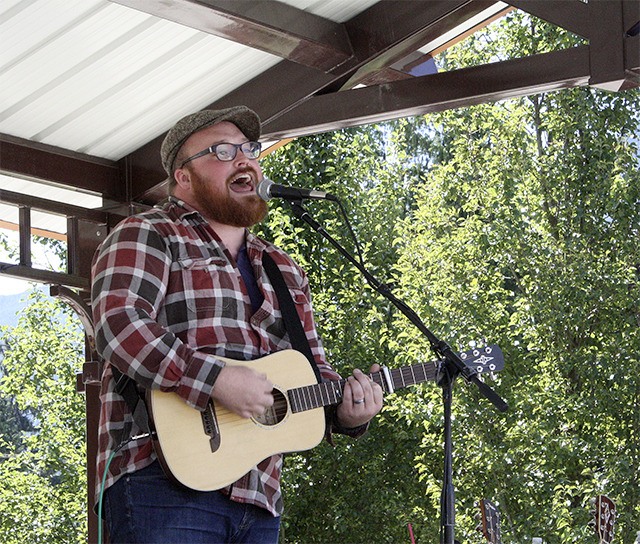 Austin Jenckes performs for a large crowd of locals during the festival on Sunday.
