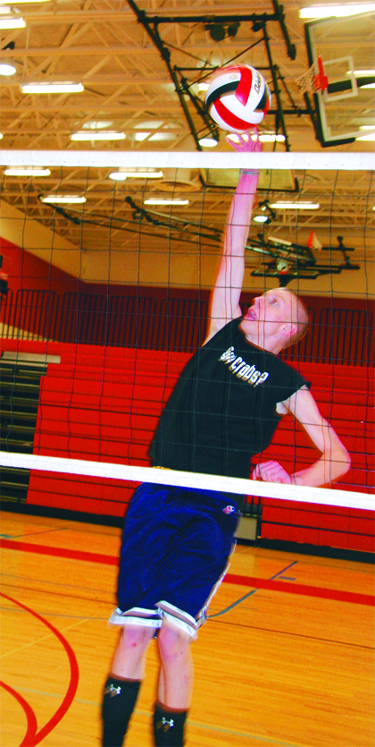 Mount Si junior Shilo Waltz swings hard on a spike during the Ridge Valley Volleyball club practice. The team formed following fan reaction to last fall’s girls team performance.