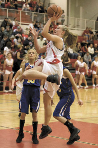 Aubrey Larion soars for the basket during play at home last Friday