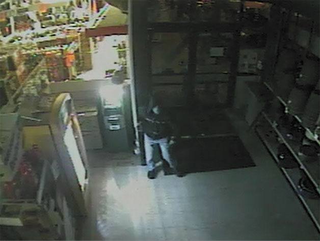Security cameras captured this hooded intruder at the North Bend ACE Hardware store on April 18. He left on a bike