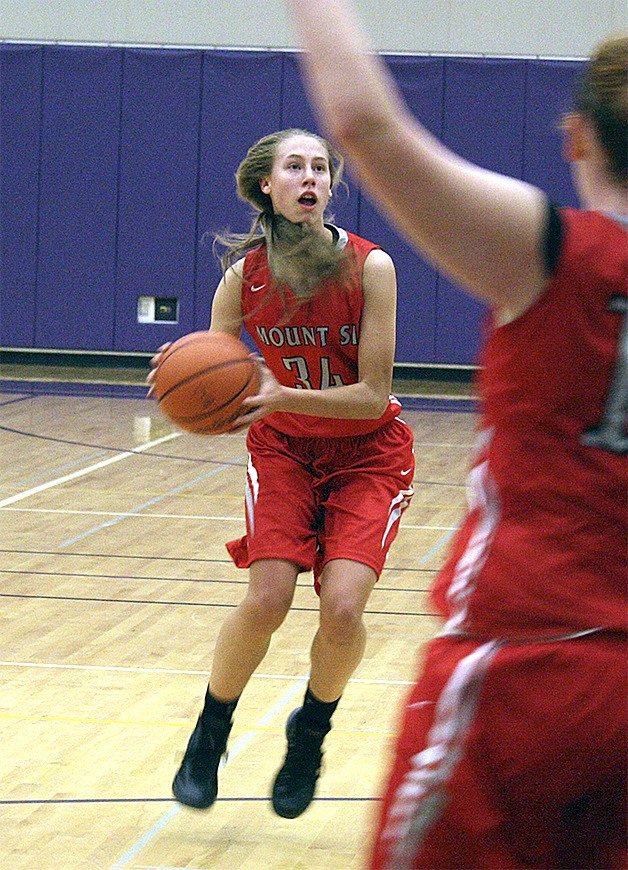 Mount Si guard Camryn Buck sees an opening for a pass against Issaquah on Dec. 17.