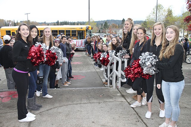 Students lined up outside Mount Si High School Friday morning to send off the cross country teams to state competition.
