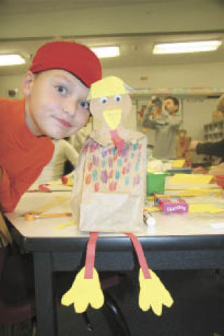 Fall City Elementary student Eli Pfister shows off his “construction worker turkey.” Pfister and fellow students recently wrote stories from the Thanksgiving turkey’s point of view.