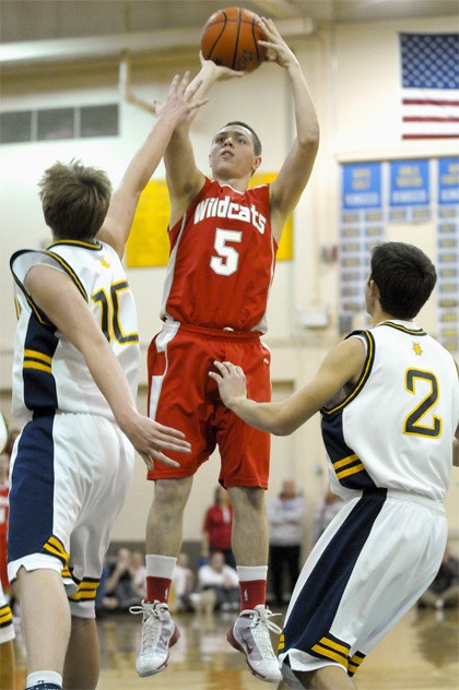Wildcat guard Justin Downer pulls up for a jump shot at Bellevue on Friday. The Wolverines beat Mount Si 64-52.
