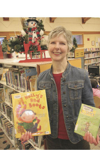 Children’s librarian Kate Patrick encourages parents to make reading with their children a regular activity. Valley libraries offer books for children of all ages