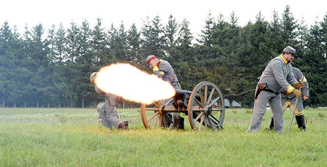 Confederate artillerymen fire their cannon in the opening volleys of the Battle of Snoqualmie Saturday. None of the weapons used during the re-enactment shot projectiles