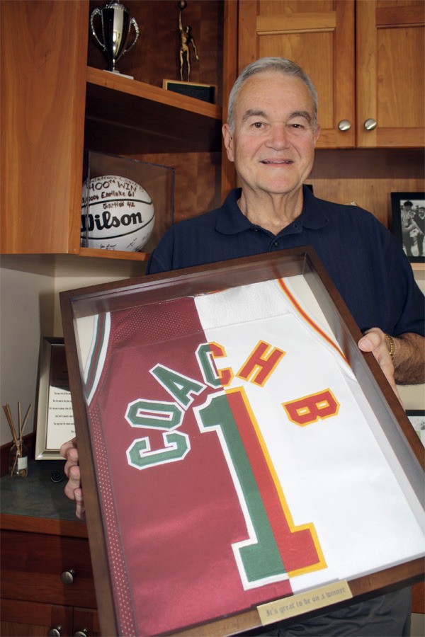 Snoqualmie hall-of-famer and former Newport and Eastlake head basketball coach Richard Belcher holds a memento from glory days: a dual jersey made up of pieces from schools where he made a powerful impact. Belcher loved to take underperforming teams to new places. 'I was looking for teams that are ready to go up